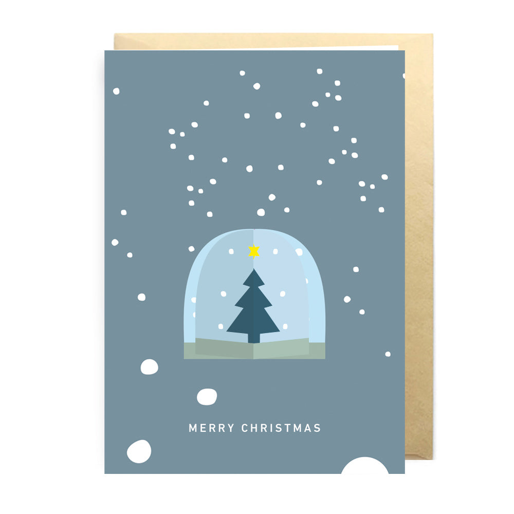 Christmas card with a snowy tree design on a blue background