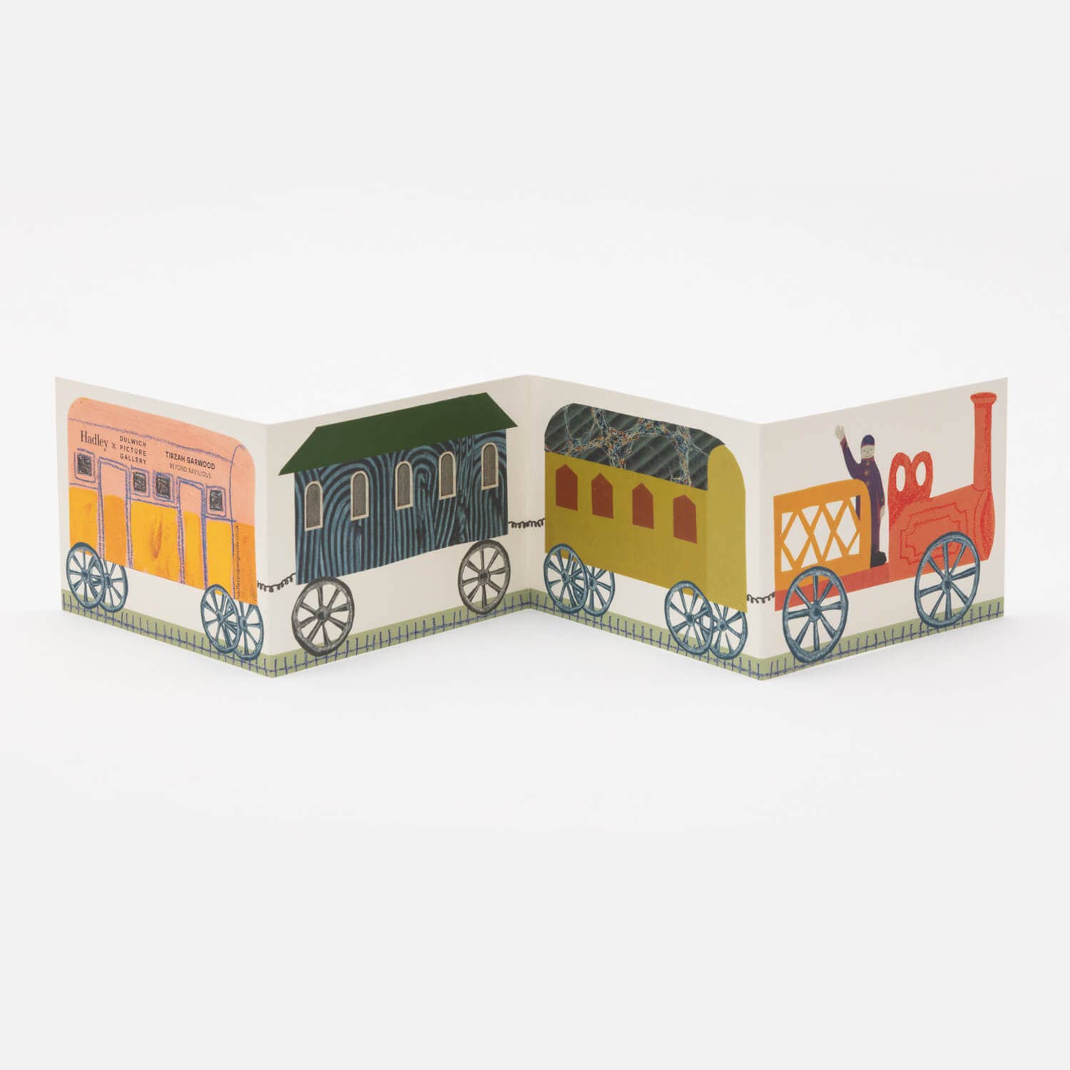 Colorful train model with cartoon-like design on a white background