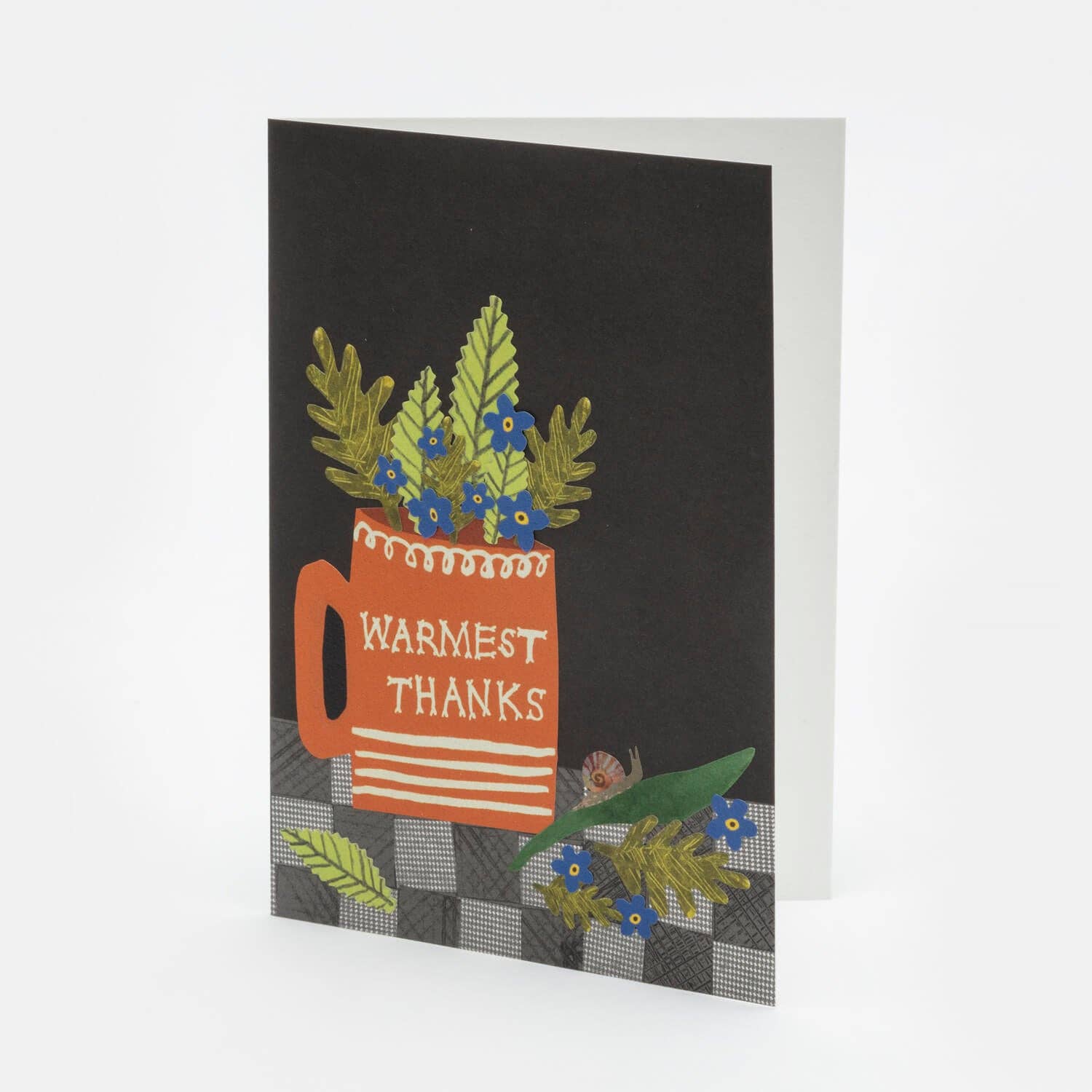 Greeting card with a red mug and floral design on a black background