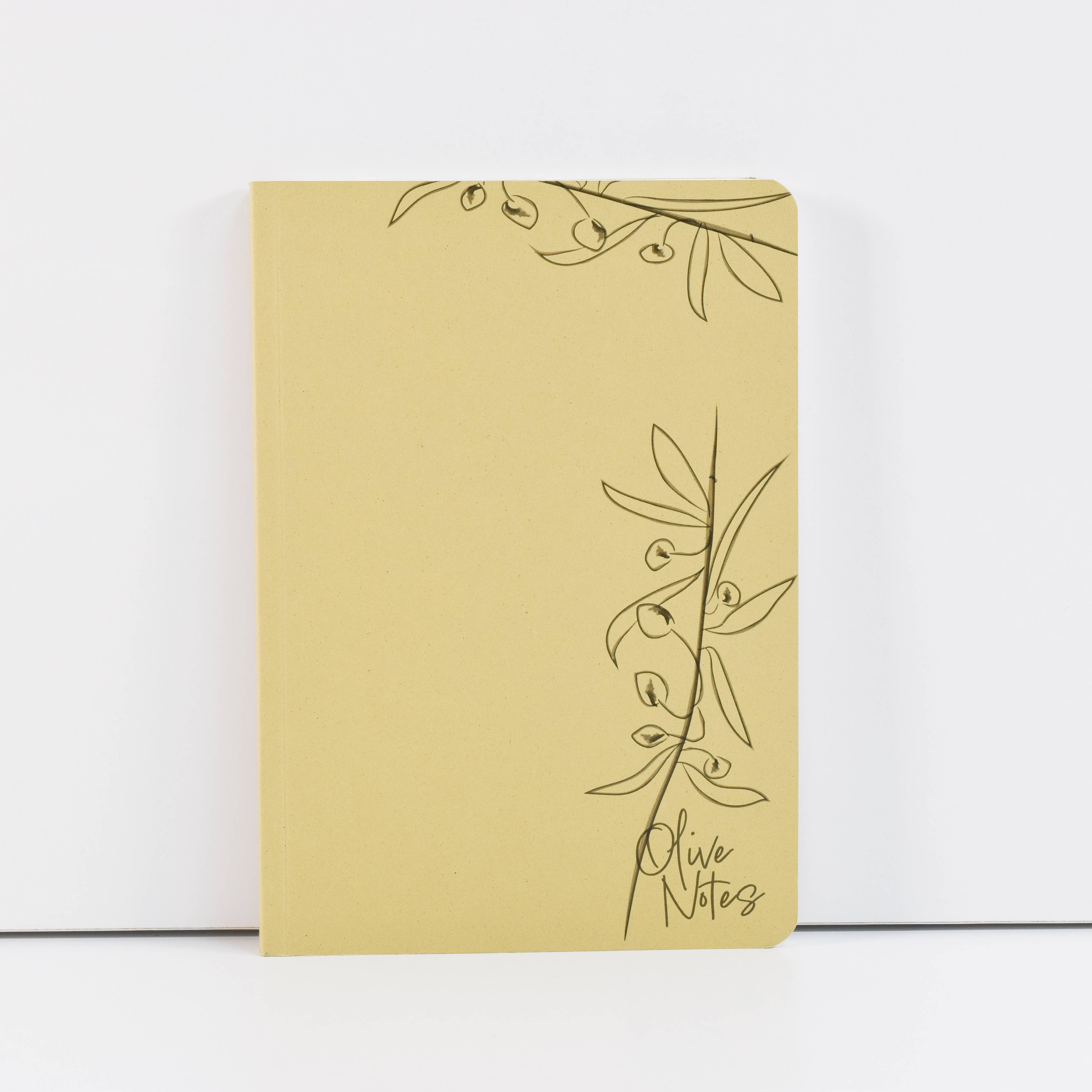 Yellow notebook with olive branch design on a white background