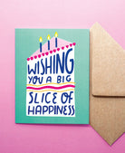 Greeting card with 'Wishing you a big slice of happiness' text and candles on a pink background