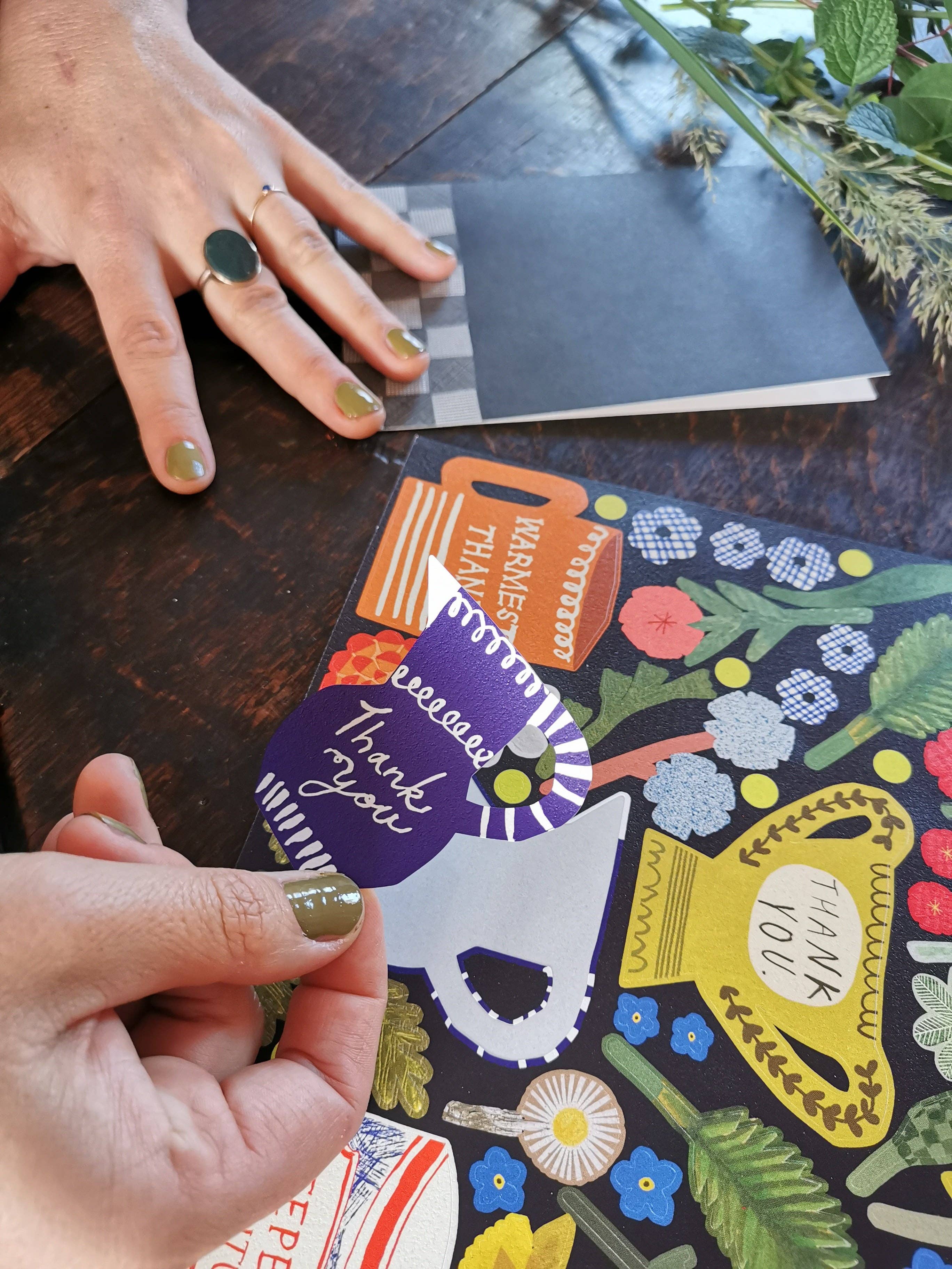 Colorful card with a dog illustration and text on a wooden surface.