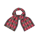 Plaid scarf with red, black, and orange pattern on a white background