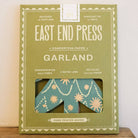 Packaged product from East End Press on a wooden surface with a neutral background