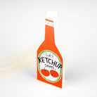 Ketchup bottle-shaped card with 'Let's Ketchup soon' text on a white background