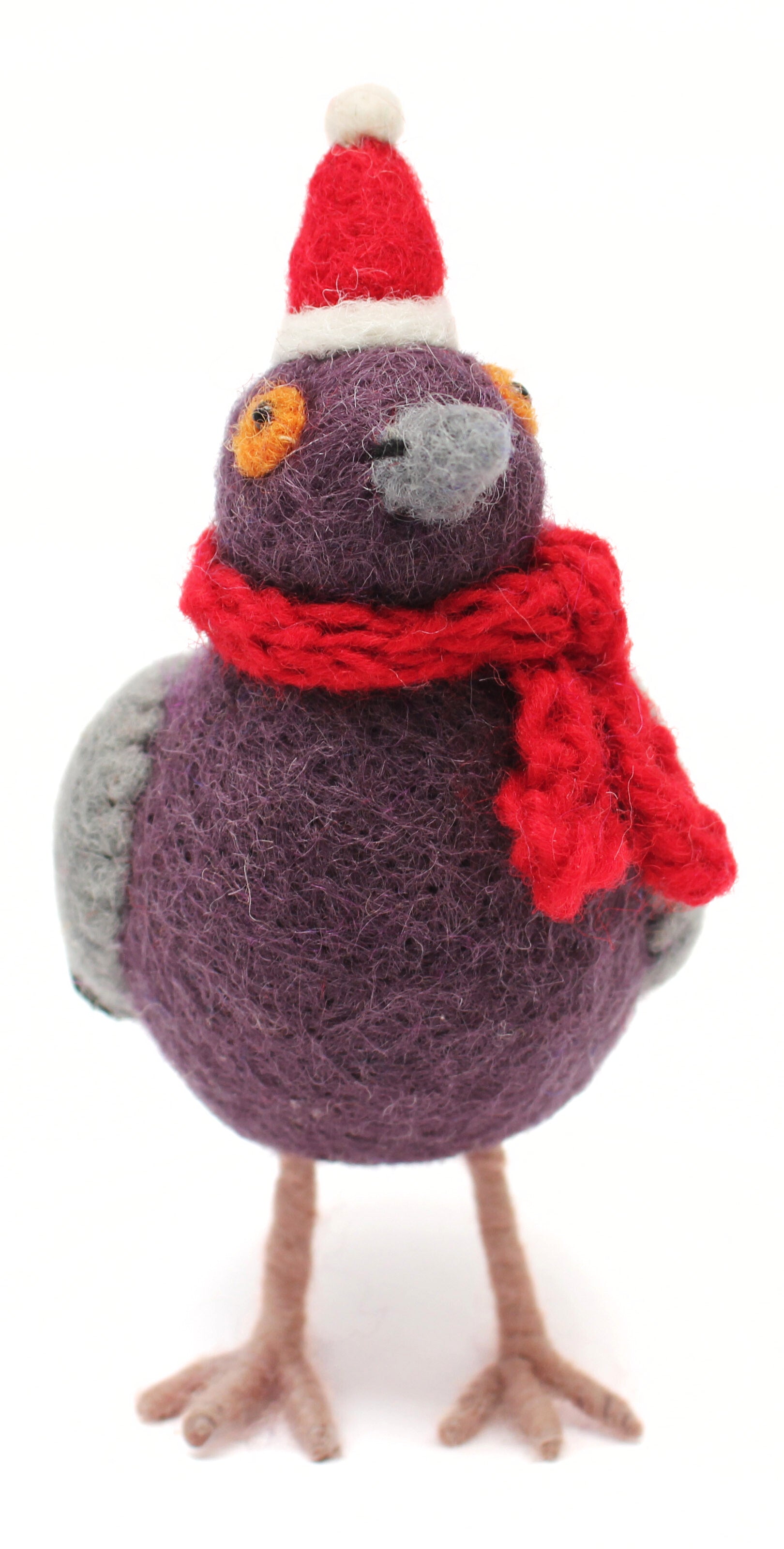 Knitted bird toy wearing a red scarf and Santa hat on a white background