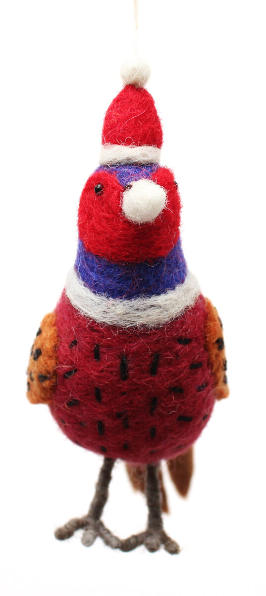 Decorative bird ornament with a red body, blue wings, and a white hat on a white background