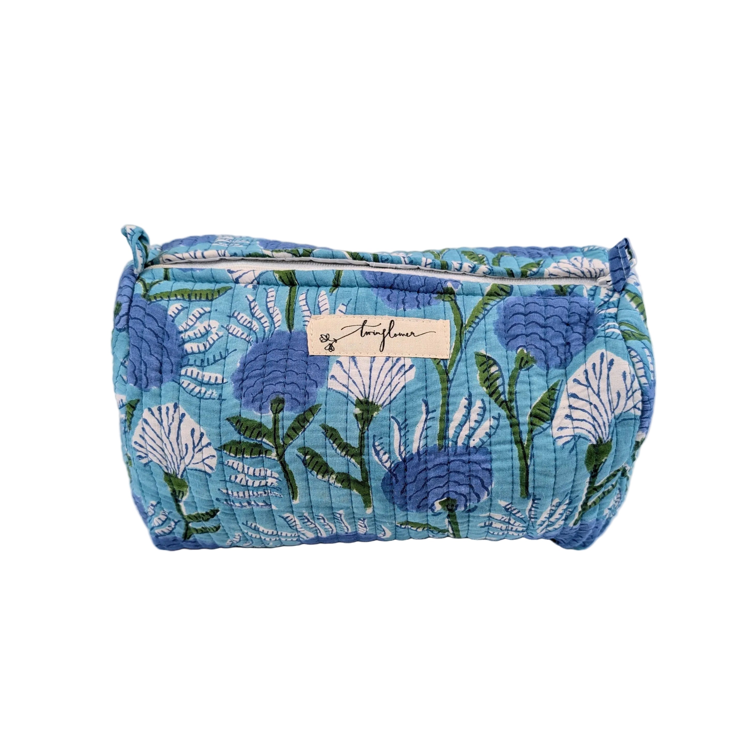 Blue floral patterned pouch with a visible brand label on a white background