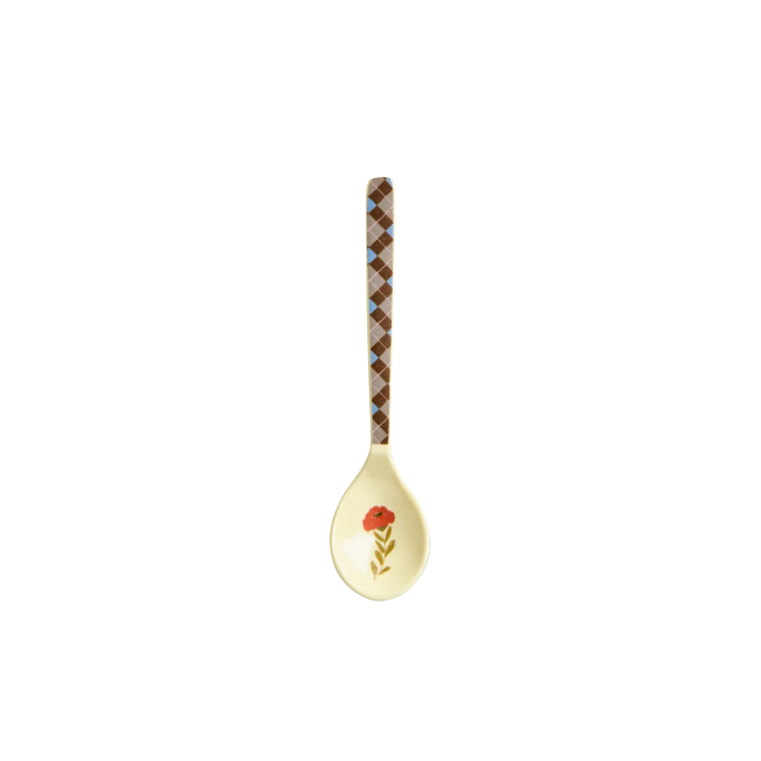 Decorative spoon with a floral and checkered design on a white background