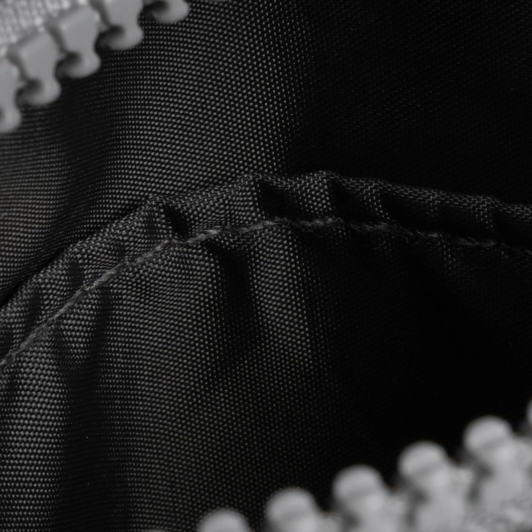 Close-up of black fabric with stitching detail