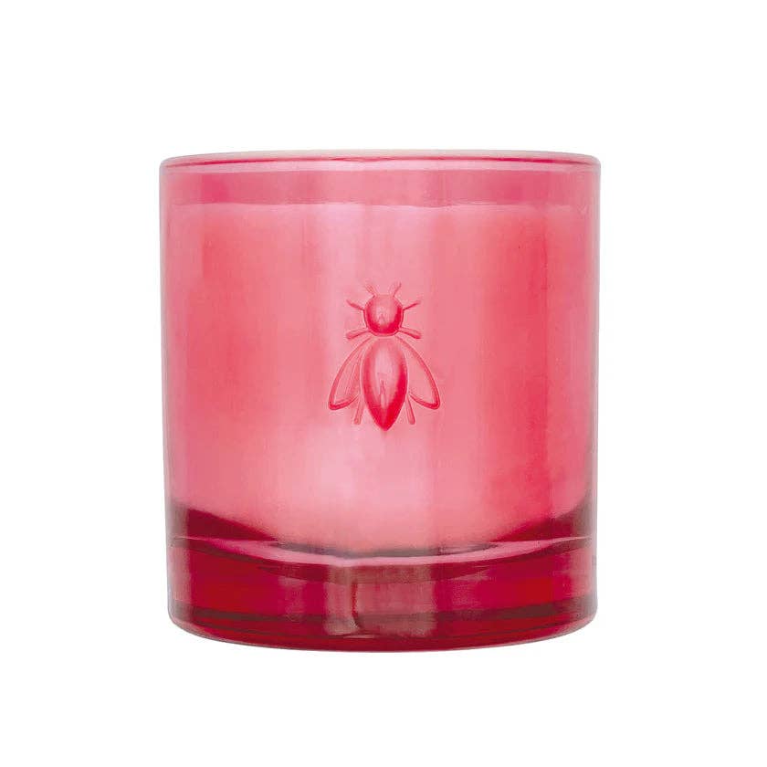 A large candle with glass container.