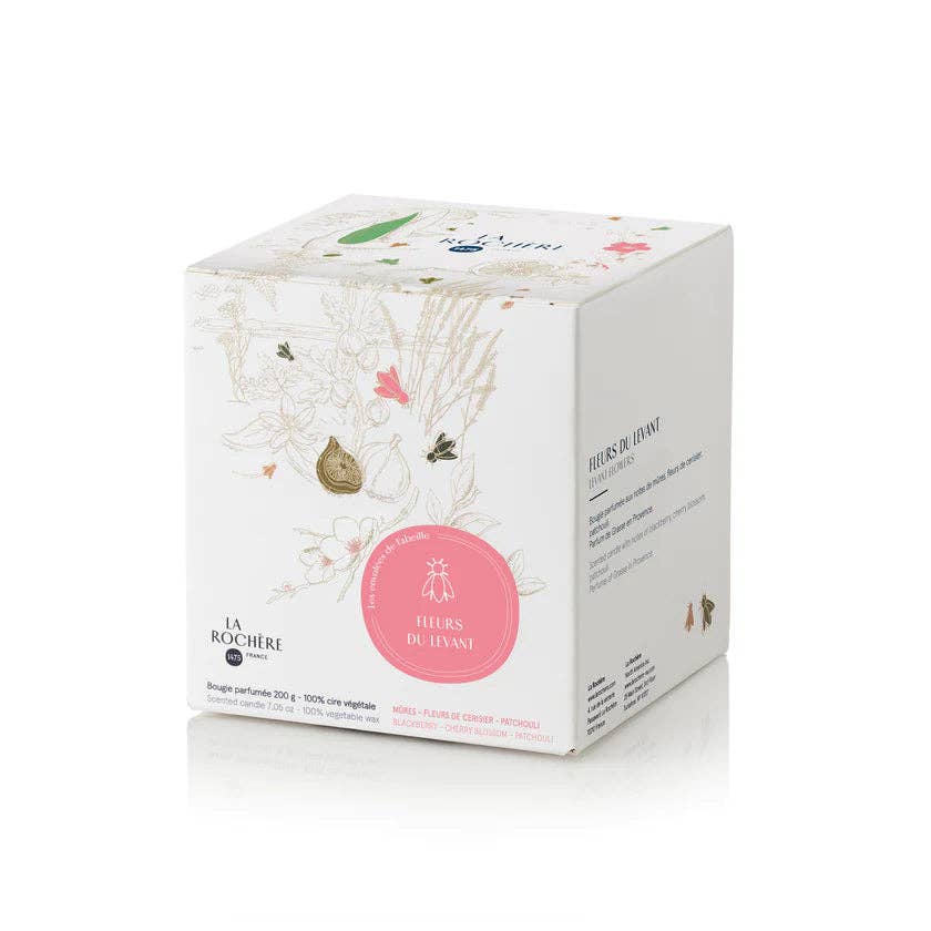 A white box with illustrated fauna and flora, showing the brand name and scent.