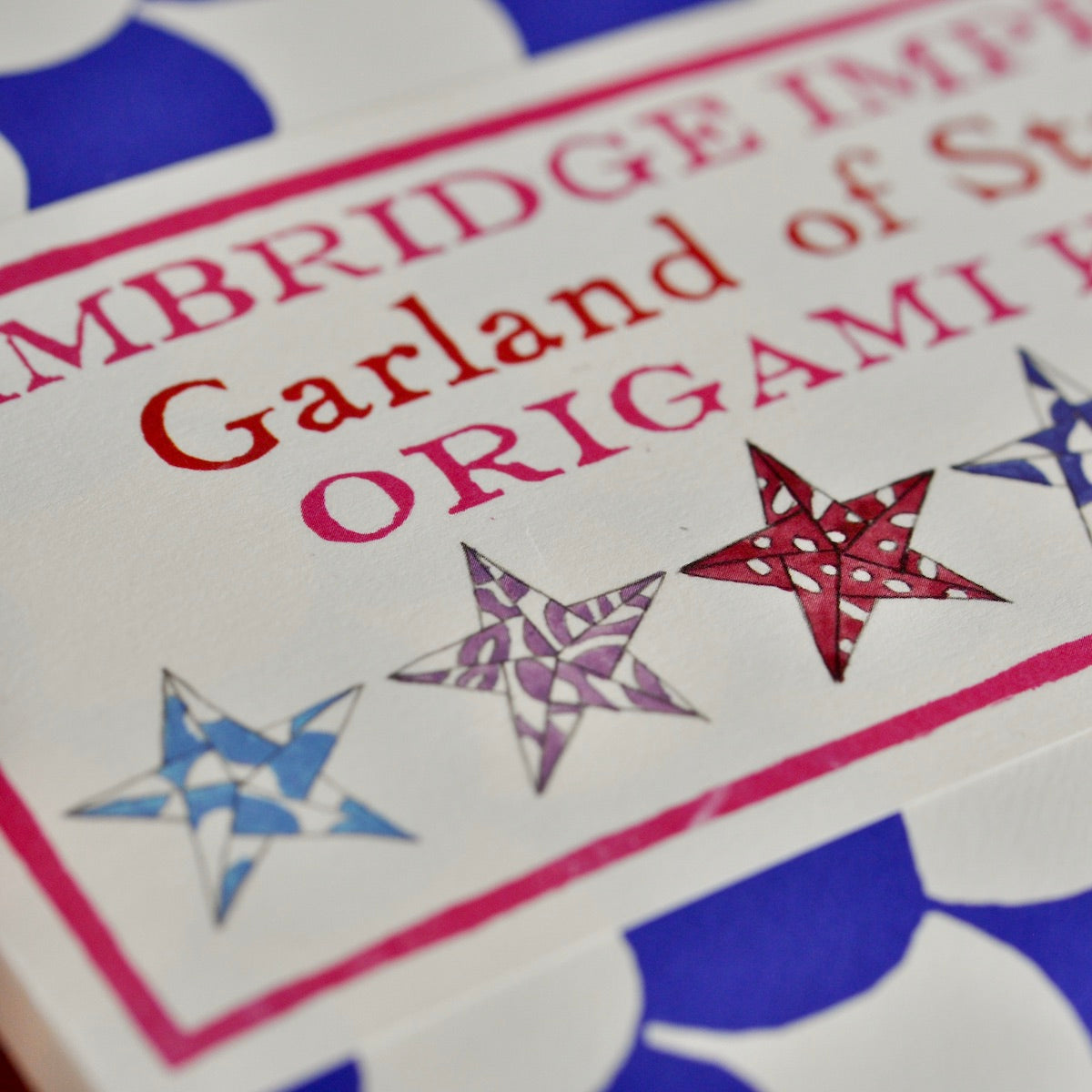 Cambridge Imprint Garland of Stars Origami book cover with star designs.