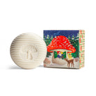 White textured mushroom-shaped object next to a colorful box with a forest design