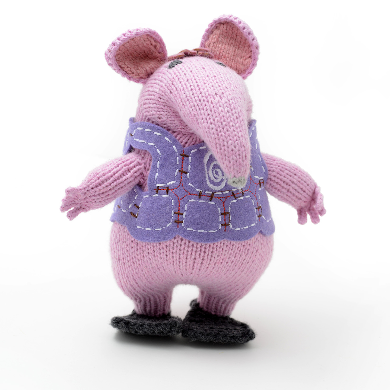 A pink knitted mouse plush toy wearing a lavender-purple vest and black shoes, shown on a white background.