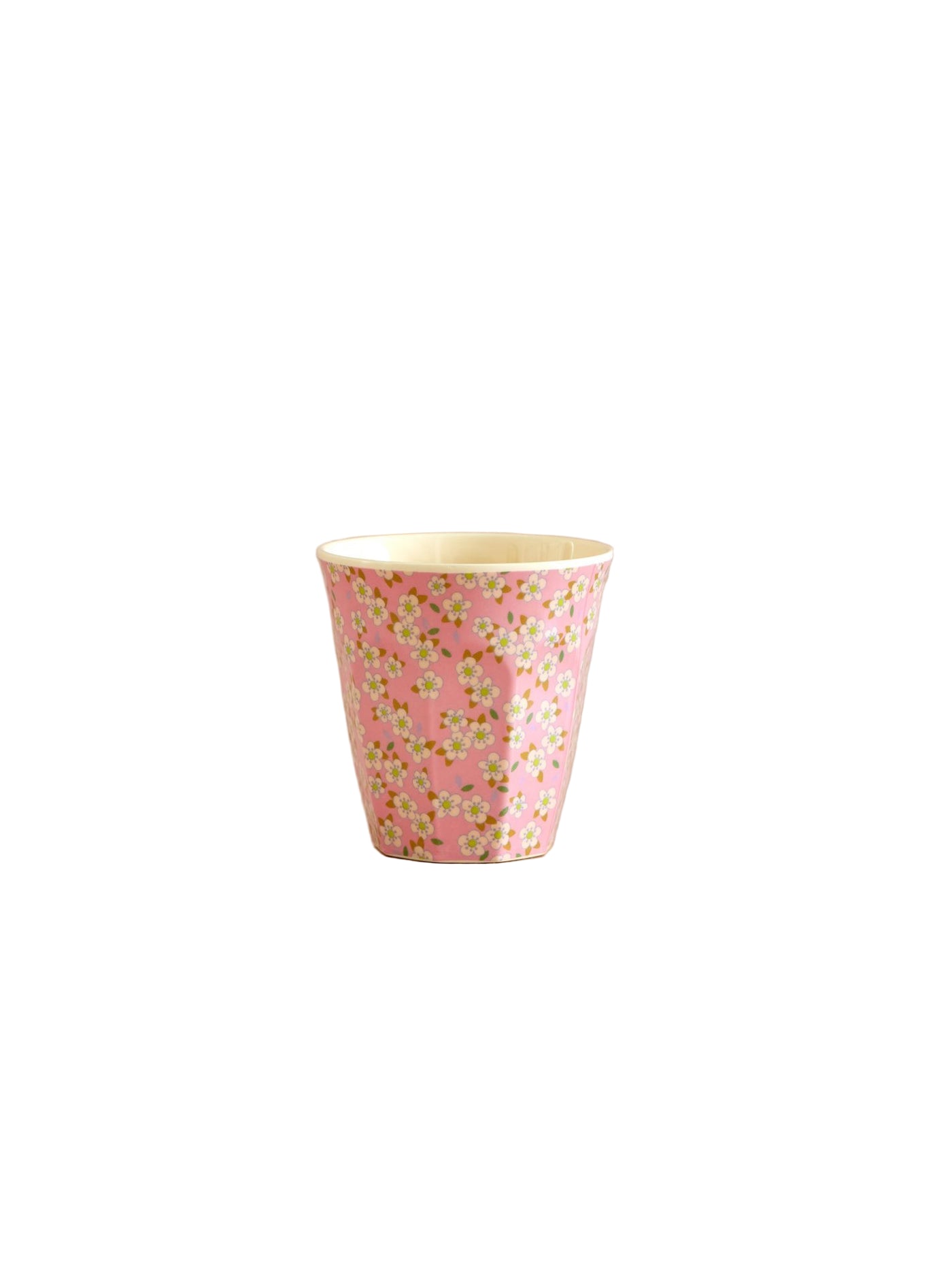 Pink floral-patterned cup on a beige background