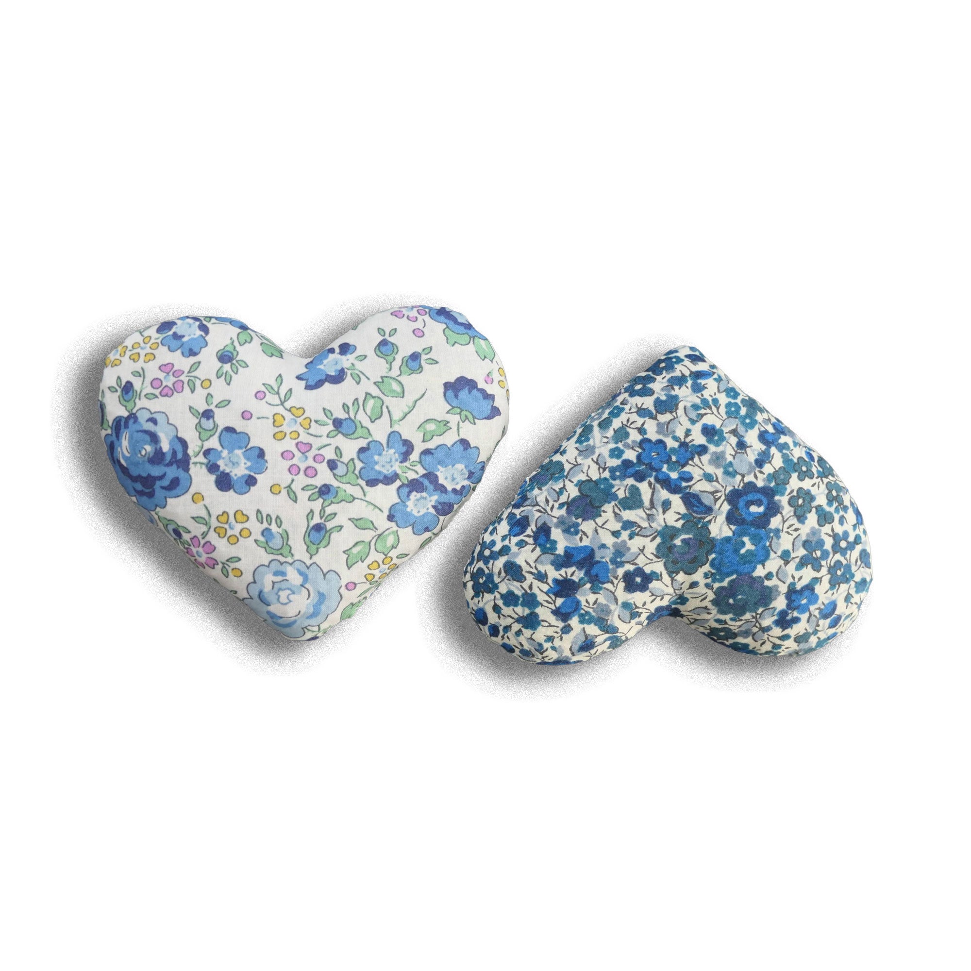 Two heart-shaped lavender hearts with blue floral patterns on a white background
