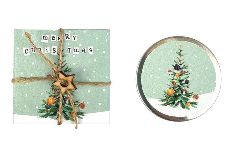 Christmas-themed card with decorative string and a small round mirror featuring a Christmas tree design.