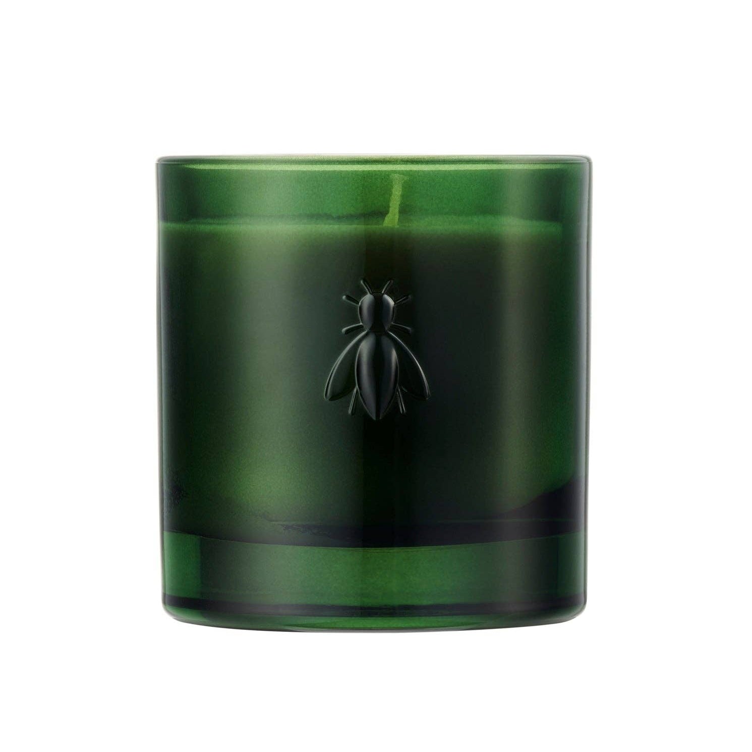 Green glass candle with a bee on a white background