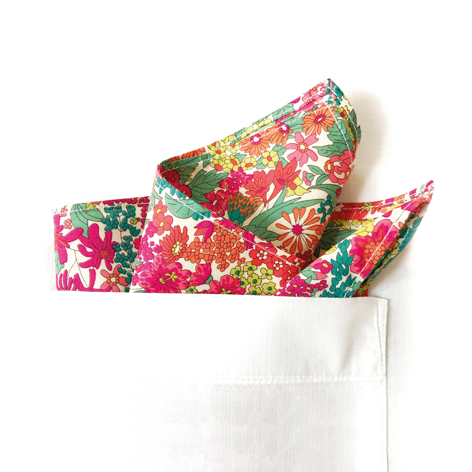 Floral-patterned cotton hanky in a pocket on white