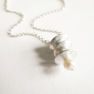 Necklace with a shell pendant on a light background