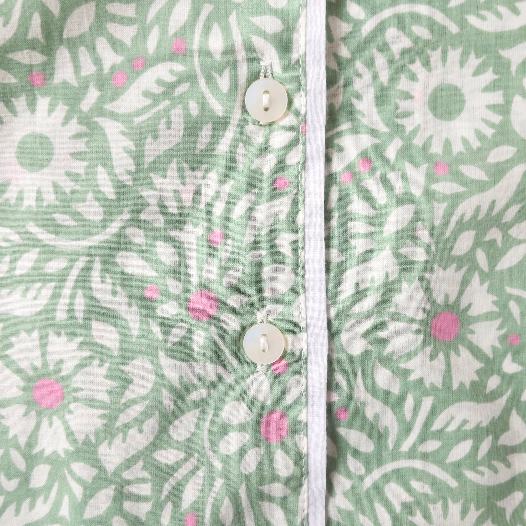 Close-up pyjama with a floral pattern on a green background
