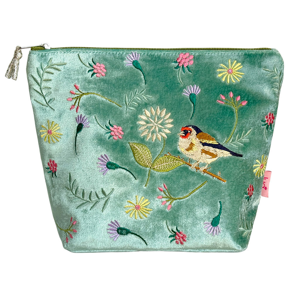 Embroidered pouch with floral and bird design on a light green background