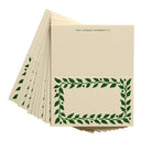 Beige paper with green leaf pattern on a white background