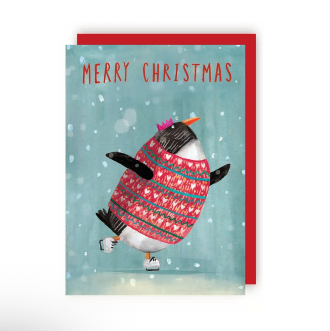 An illustrated Christmas card featuring a penguin ice skating, wearing a red Christmas jumper and pink party crown. The background is light blue-green with a white snowy texture. Text at top of the card read “Merry Christmas” in red capitalised text.