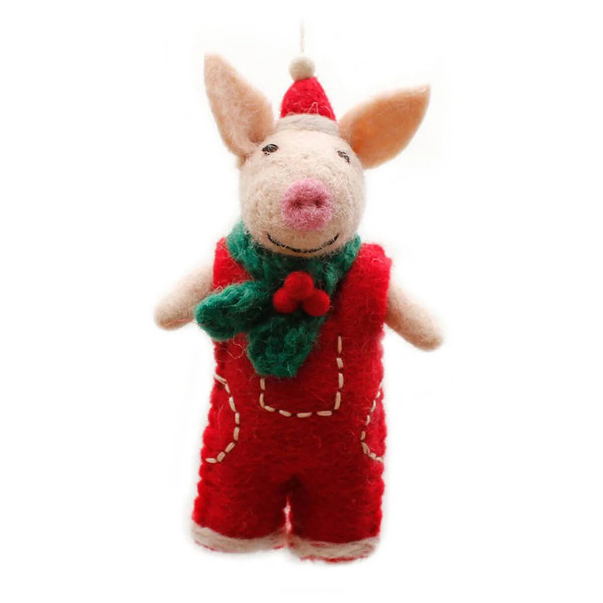 A handmade felted wool Christmas ornament shaped like a pig wearing red overalls, a green scarf, and a red Santa hat, set against a plain white background.