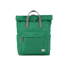 Green backpack with gray straps on a white background