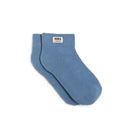 Pair of blue socks with a visible brand label on a white background