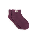 Maroon sock with 'ROKA' label on a white background