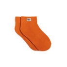 Orange socks with a visible brand label on a white background