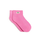 Pink socks with 'ROKA LONDON' label on a white background