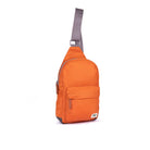 Orange sling bag with a gray strap on a white background