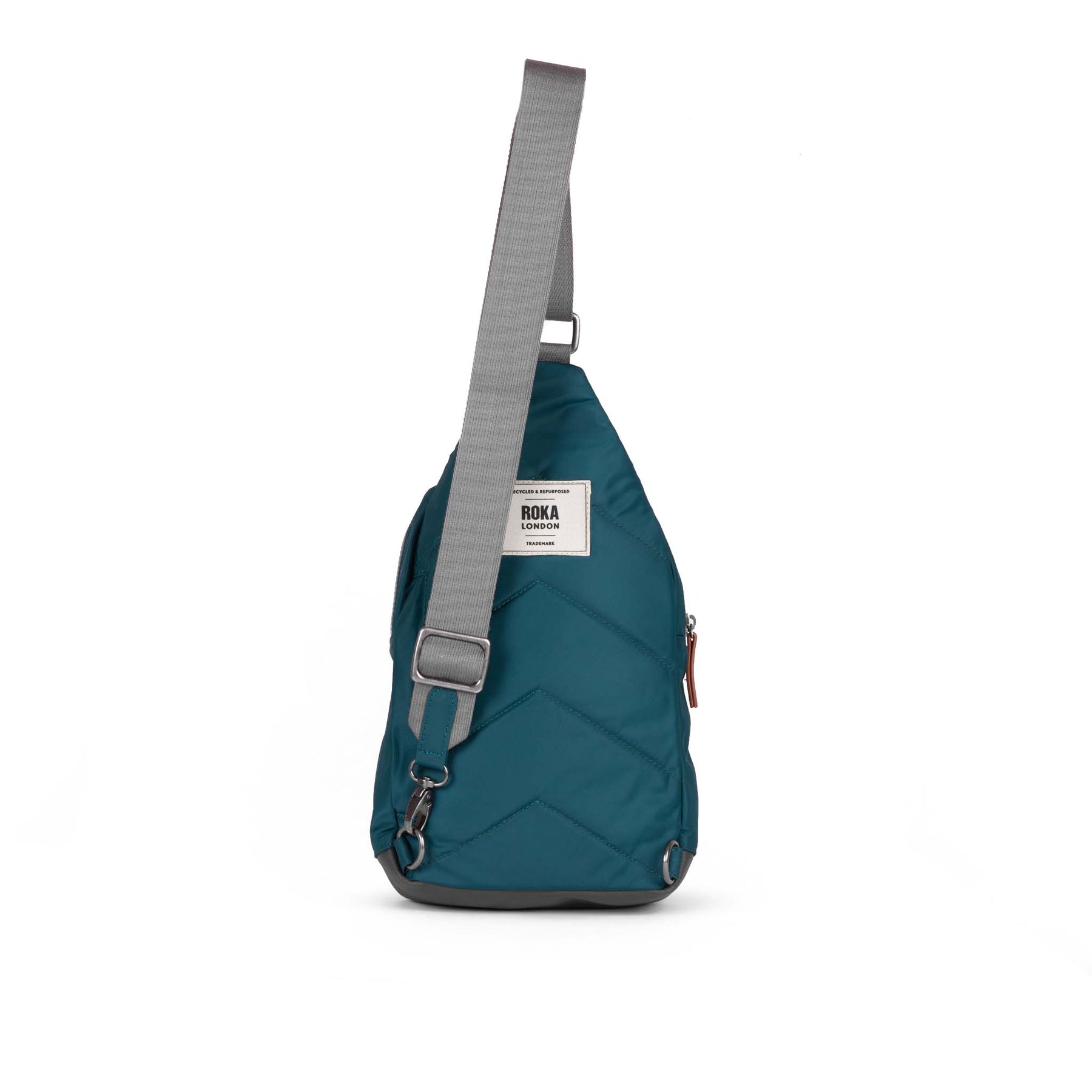 Teal sling bag with gray strap on a white background