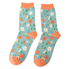 Floral patterned socks with orange accents on a white background