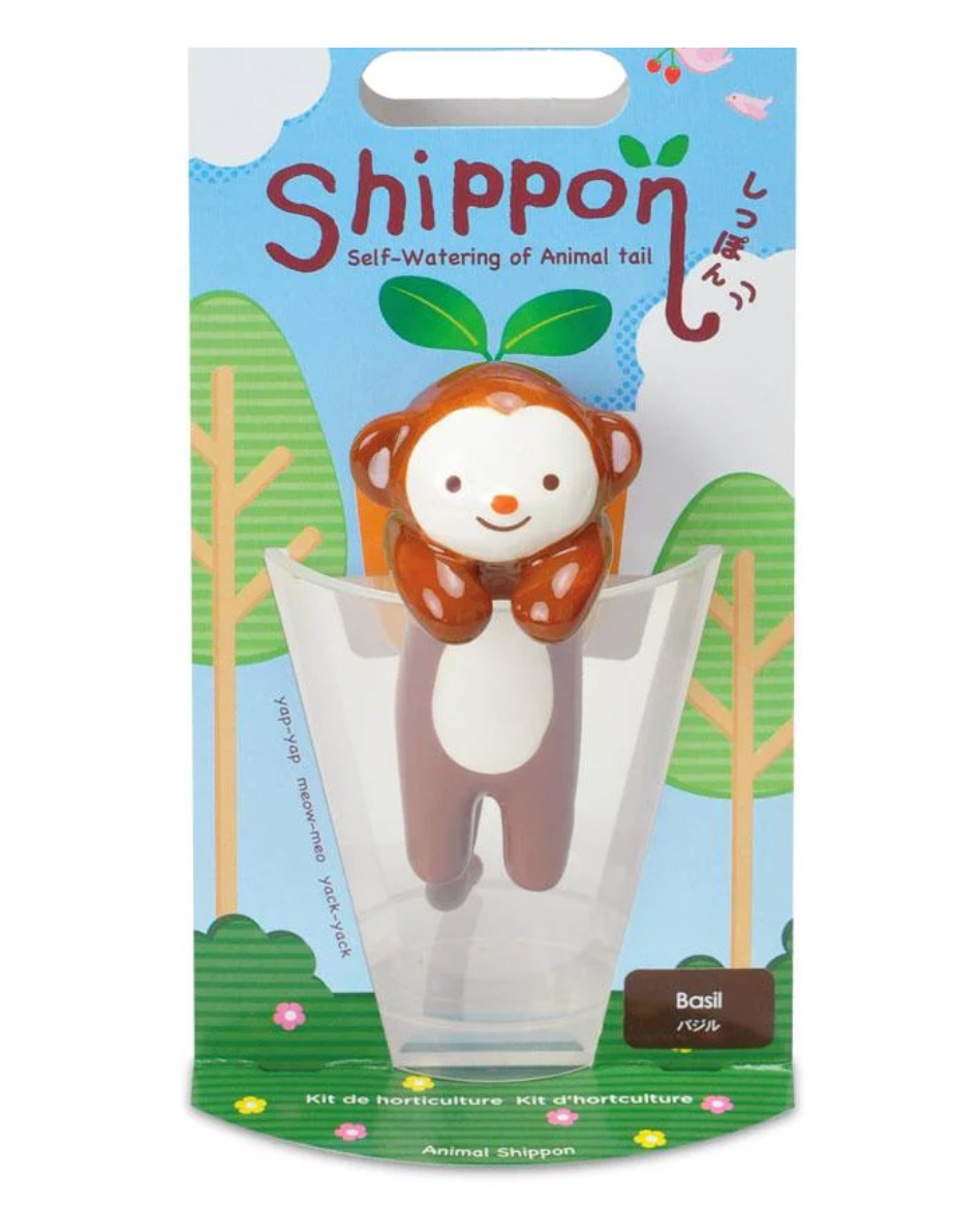 Packaging of a self-watering plant pot with a monkey design on a white background