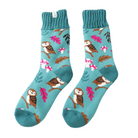Teal socks with owl and leaf pattern on a white background