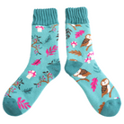 Teal socks with nature-themed design on a white background