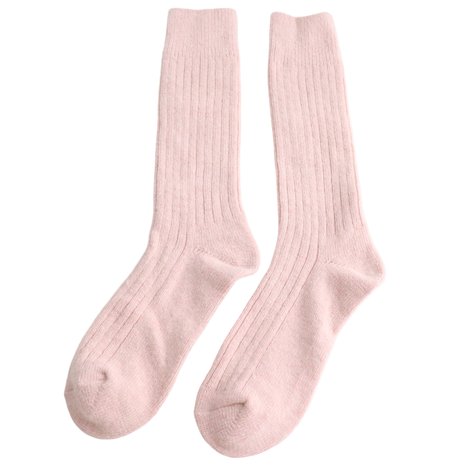 Pair of pink  socks on a light gray background
