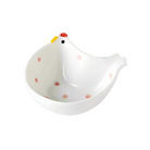 Ceramic chicken-shaped container with red spots on a white background