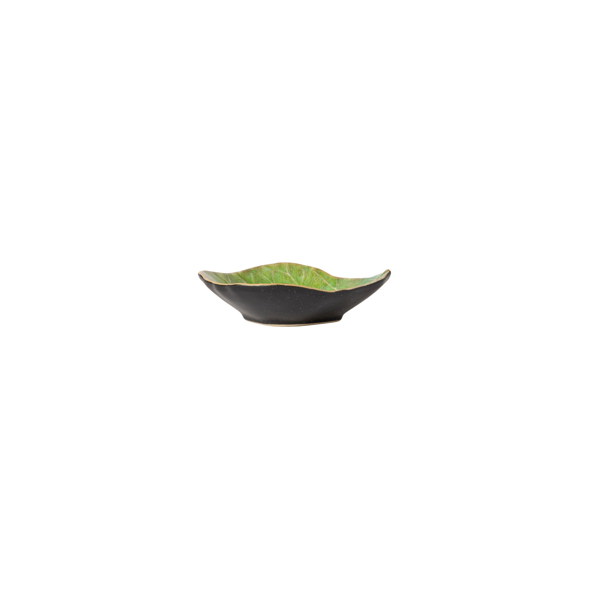 Black ceramic bowl with green interior on a white background