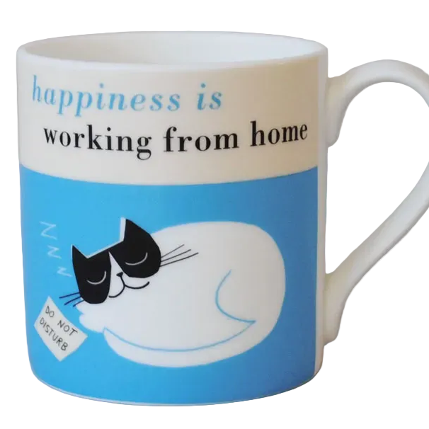 Mug with a cat illustration on a blue background and text 'happiness is working from home' shown displayed on a plain background