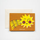Greeting card with a smiling sun illustration and 'You are a star!' text, accompanied by a beige envelope on a light gray background.