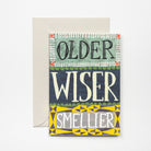 Greeting card with 'Older, Wiser, Smellier' text on a colorful background