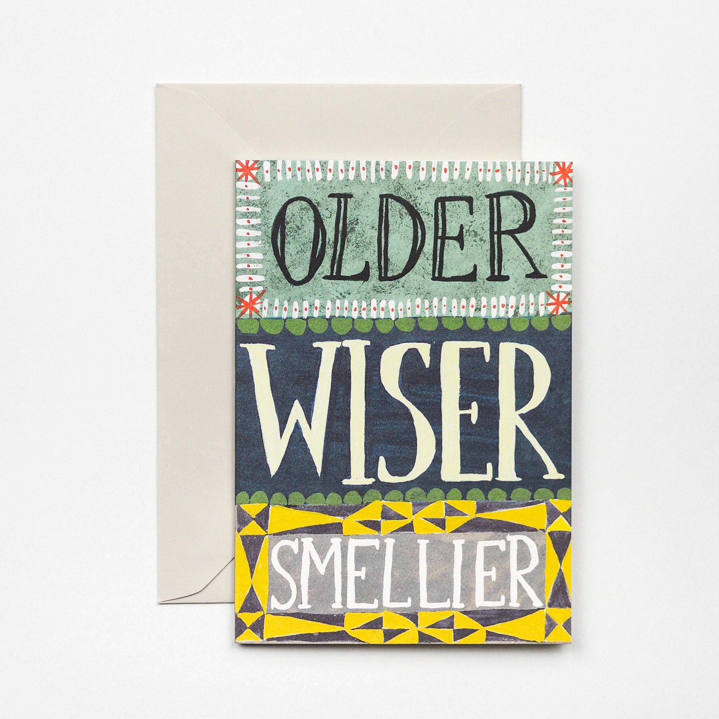 Greeting card with 'Older, Wiser, Smellier' text on a colorful background