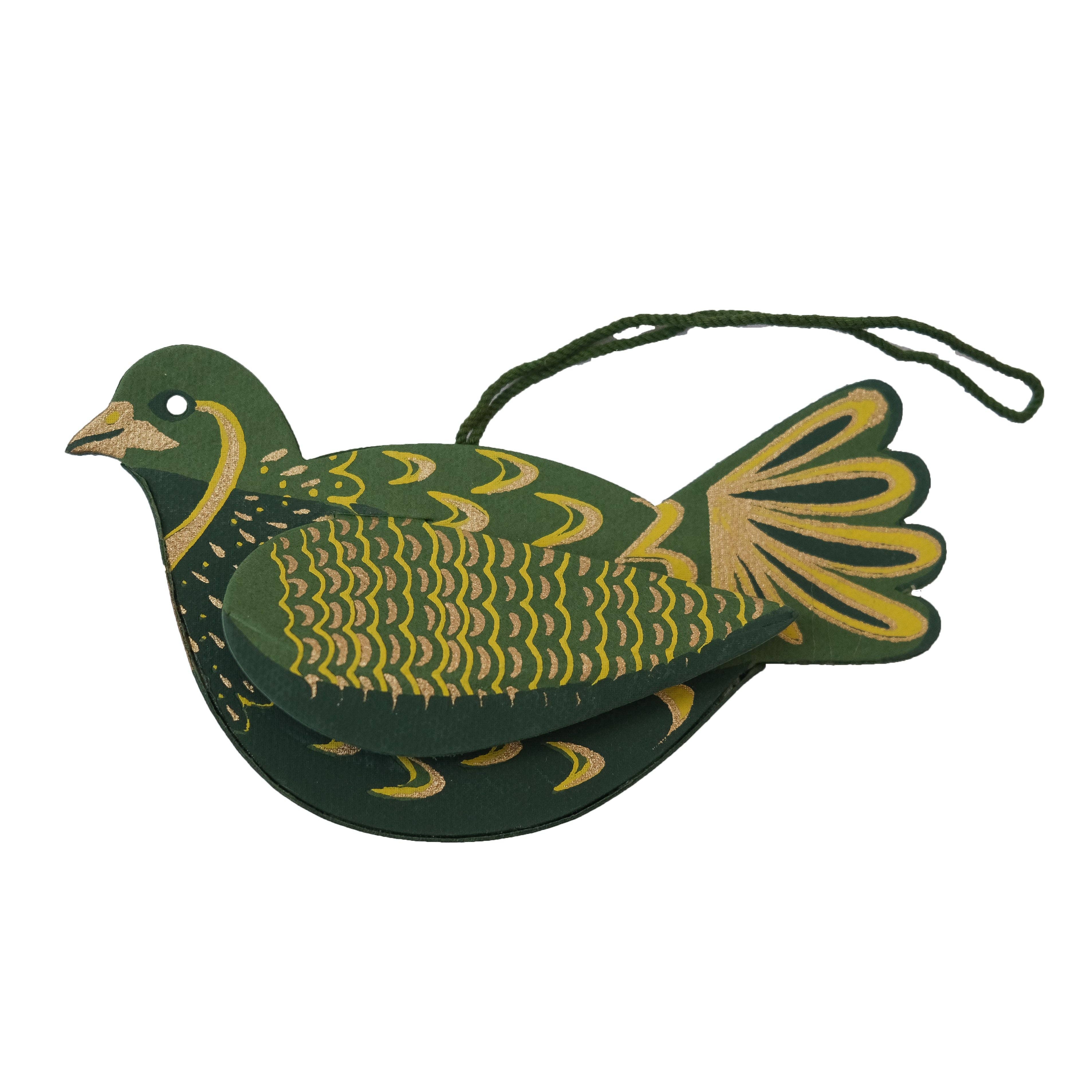 Decorative green and gold bird ornament on a white background