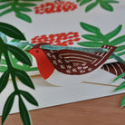 Card with a robin design on a floral background